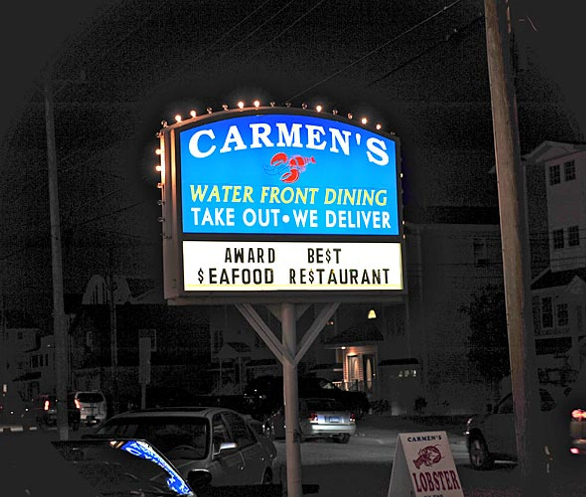 Carmen's neon sign — Award Best Seafood Restaurant